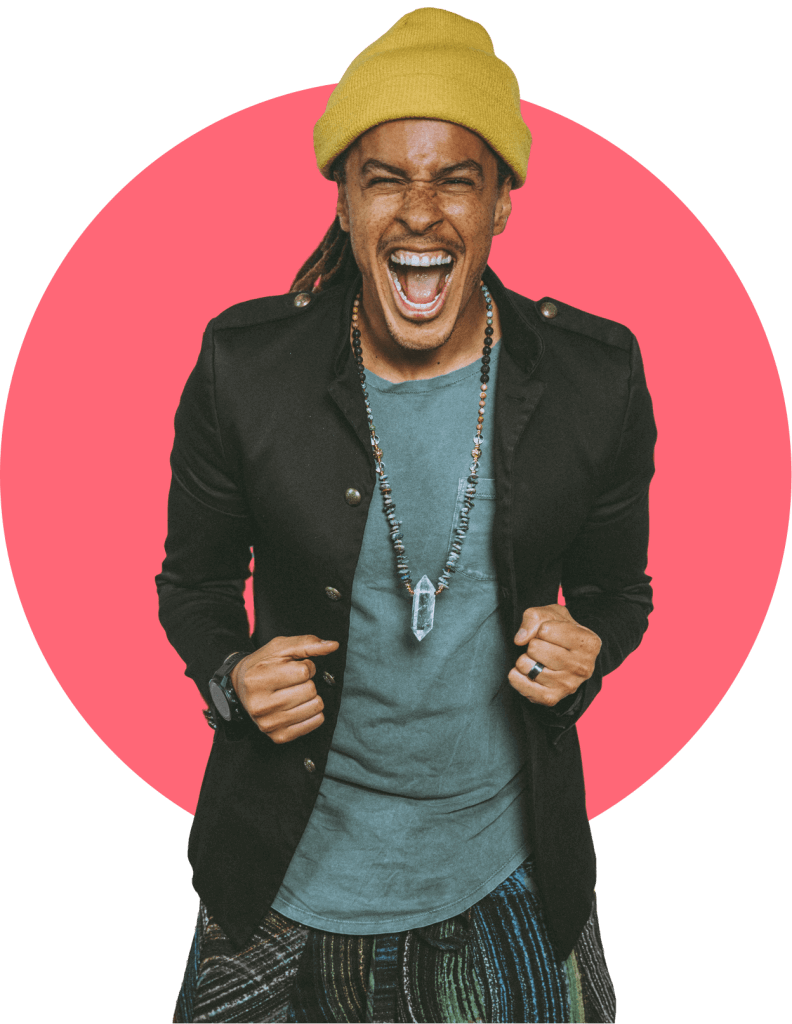 Man in a yellow beanie laughing joyfully