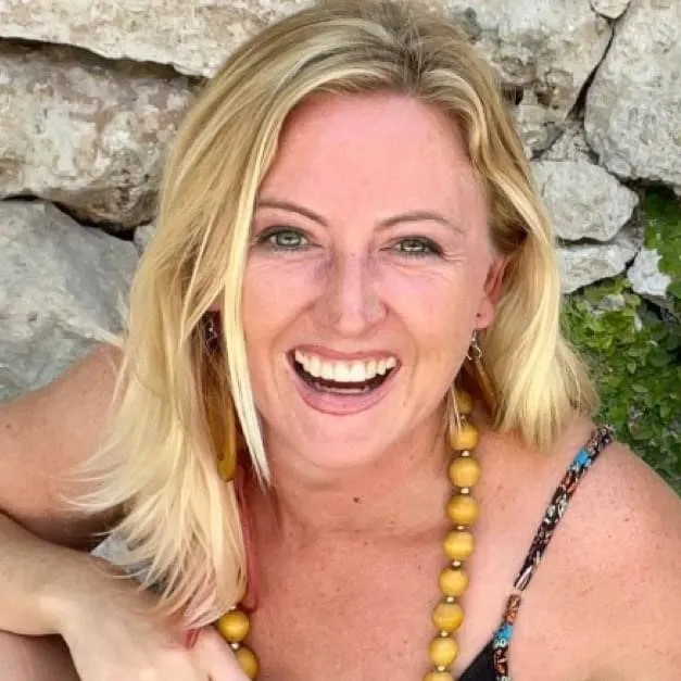 Smiling blonde woman, coach portrait