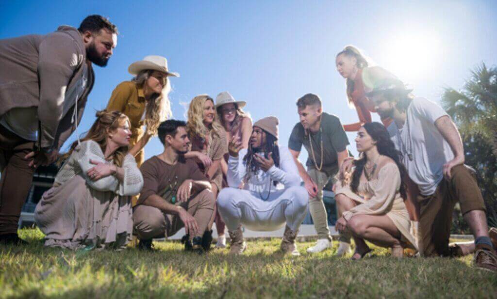 Group of creators celebrating outdoors in the sun